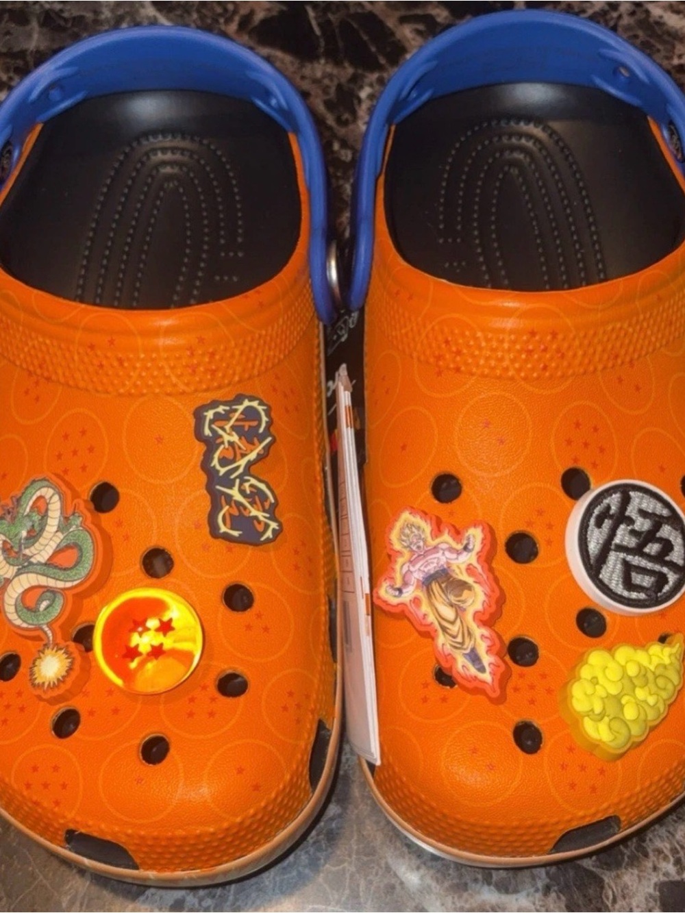 CROCS Kids Orange Clogs with Blue Heel Strap and Character Charms